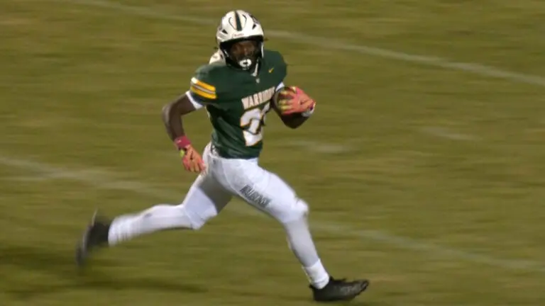 Waubonsie Valley’s Elliott runs on the field