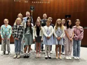 District 203 students whose artwork was selected for crime prevention calendar post with Naperville mayor