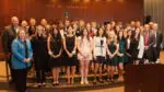 Students who were honored with the KidsMatter Youth Service Awards take a group inside Naperville Municipal Center after their ceremony