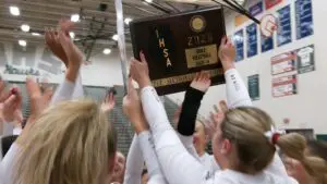 Benet Academy celebrates with girls volleyball supersectional plaque