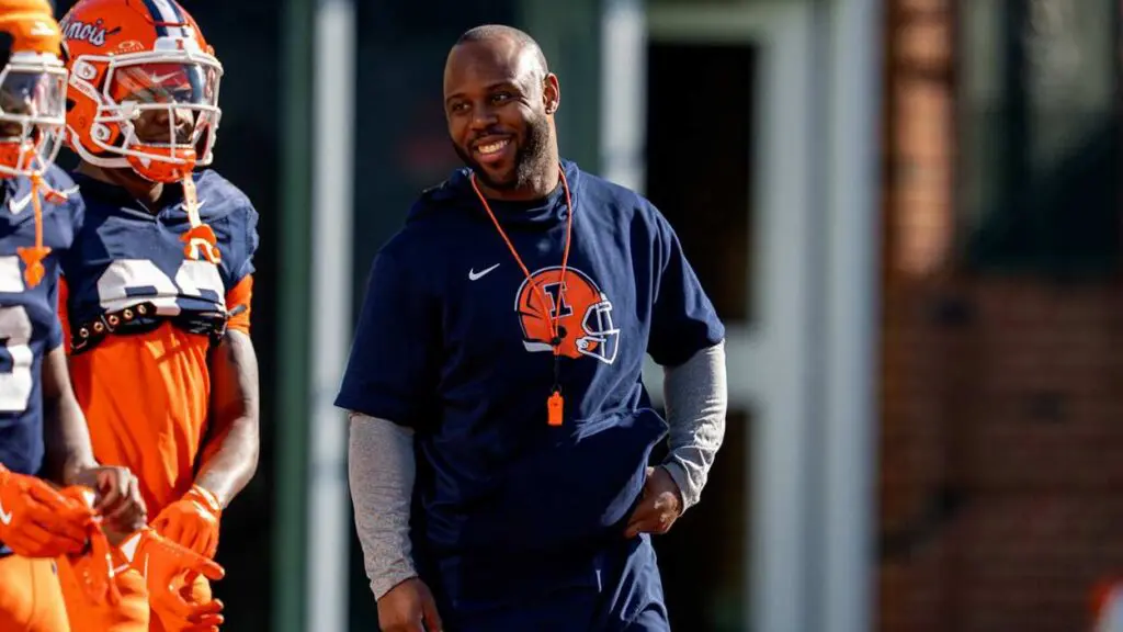 James White Benet Academy football. He smiles while coaching with the University of Illinois