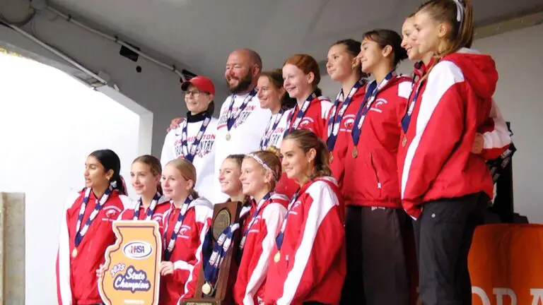 Barrington holds the IHSA 3A girls cross country state trophy