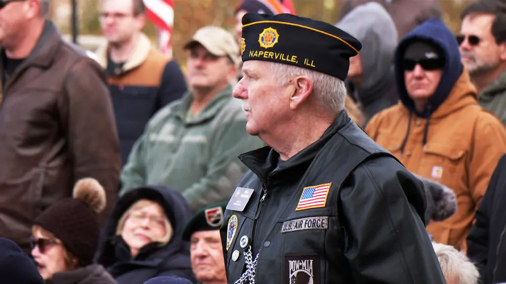 A U.S. Air Force veteran stands during Naperville's Veterans Day ceremony.