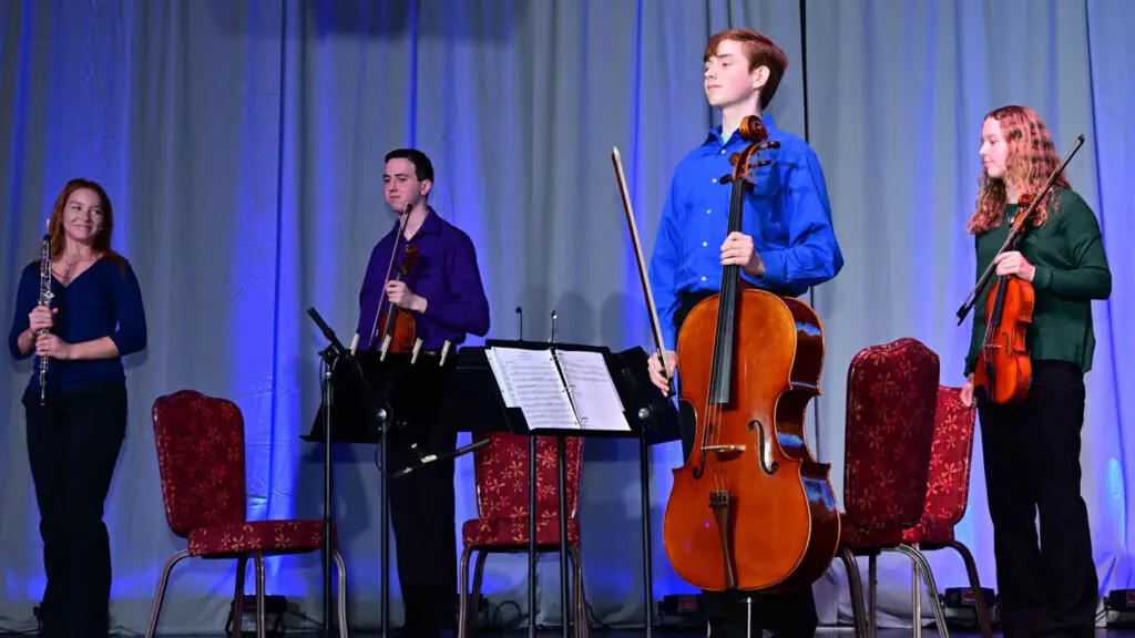 OPUS members Rayea Stewart, Brody Wise, Kesli Miller, and Logan Sassi stand on stage after their performance at “The Morning Show.”