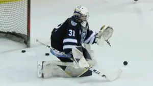 Warriors Hockey Club dominates as Warriors Hockey club goalie Tyler Bellot makes a save during warmups