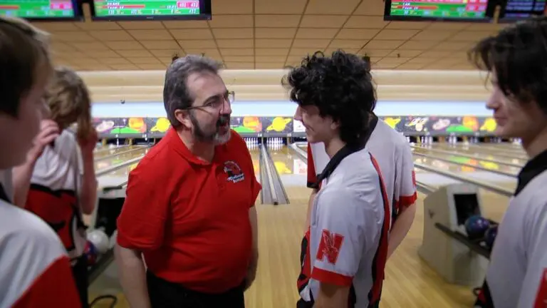 Redhawks Boys Bowling win while coach chats with players.
