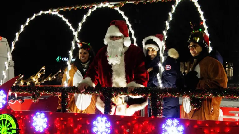 Santa and his helpers on his sleigh touring through Naperville, IL