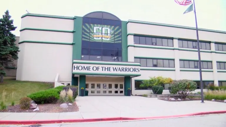 A picture of the front of Waubonsie Valley High School, with a 50th anniversary banner being displayed on the front of the building.