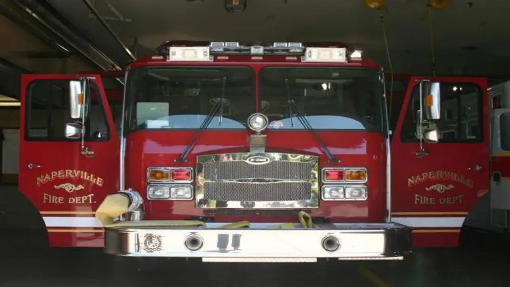 Naperville Fire Department fire truck with doors open in garage