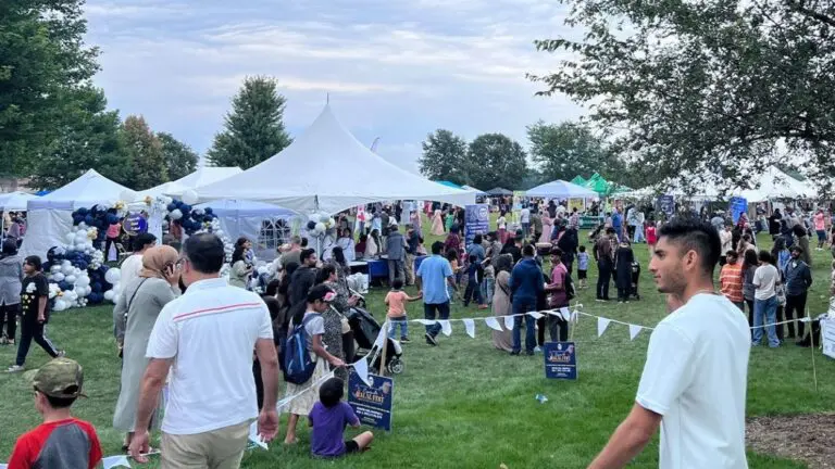 A crowd of people walks around Halal Fest in Naperville which will be moving to Glenn Ellyn this year.
