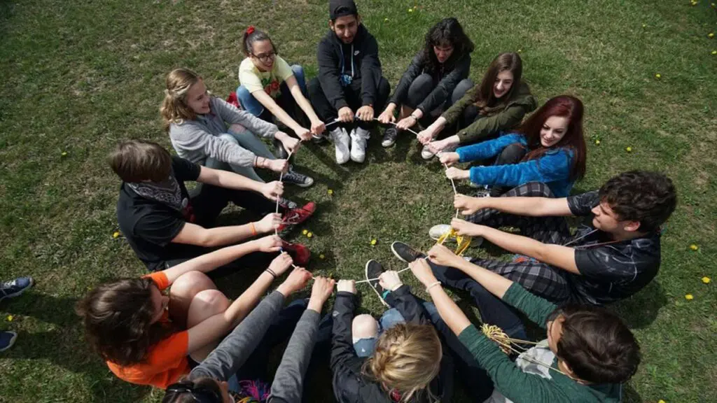 Group of teens sitting in a circle