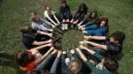 Group of teens sitting in a circle