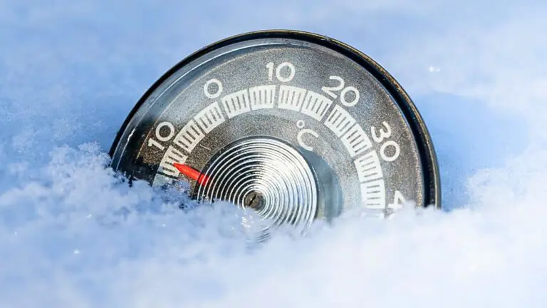 Thermometer in snow showing cold temps