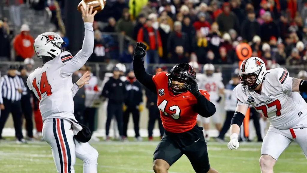 Turnovers doom North Central football in 24-14 Stagg Bowl loss to UW-River Falls. Falcons quarterback Kaleb Blaha throws a pass in the victory.