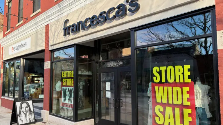 wide shot of storefront of Francescas which is closing shop