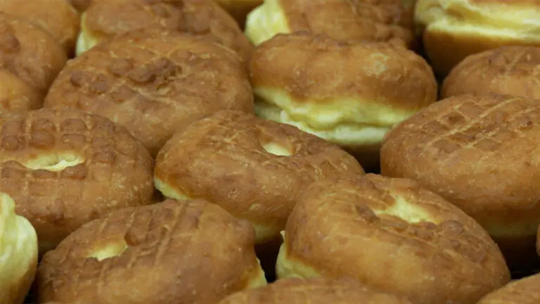 Close shot of a group of freshly-made paczki's,, polish pastry, at DeEtta's in Naperville