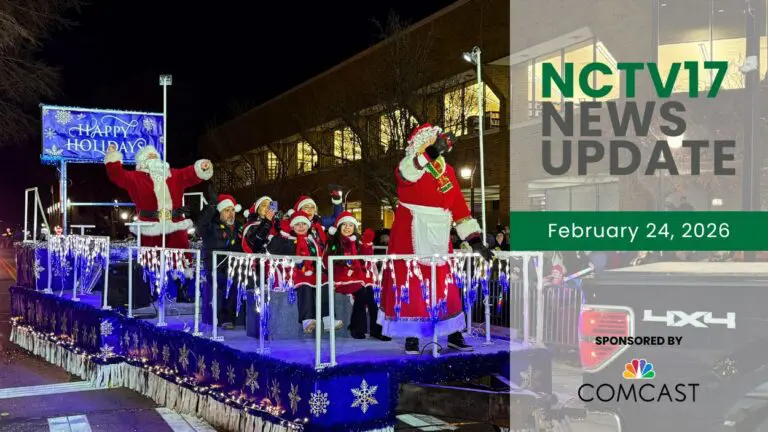 Santa and Mrs. Claus waving at crowd at Naperville Holiday Parade of Lights