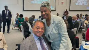Jesse Jackson and Regina Brent smile for a photo together at Rainbow PUSH Coalition's 57th Annual International Convention in 2023.