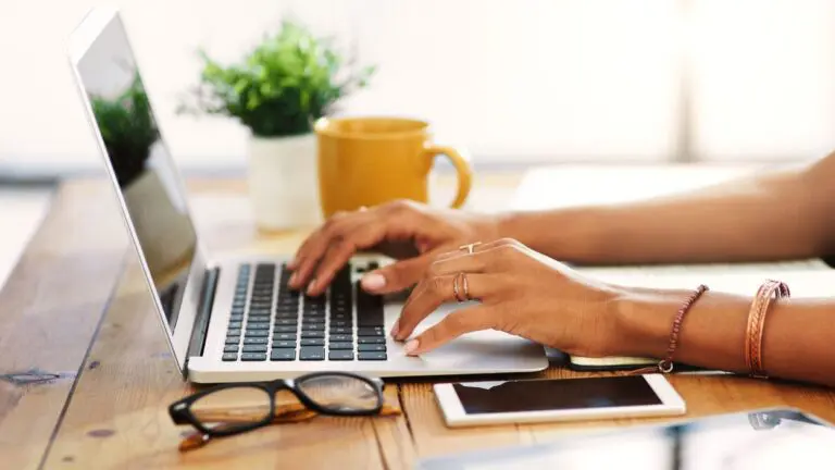 Woman typing on laptop