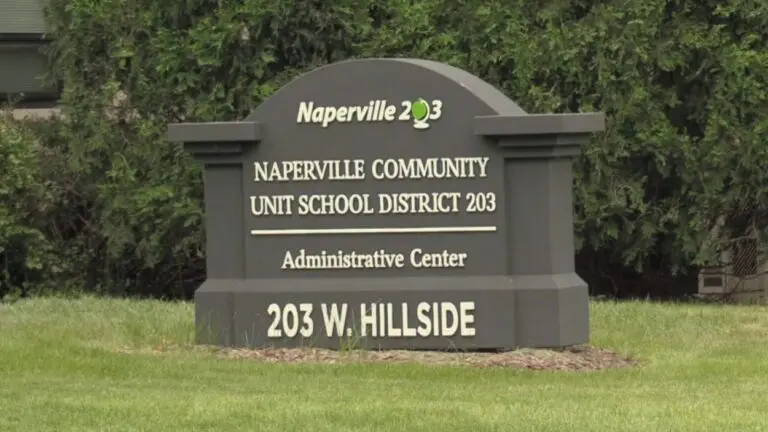 Close up of Naperville District 203 administration buildling sign for story on board president addressing circulating claims