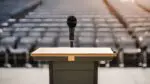 Empty podium on stage looking out into the audience