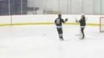 Michael Chenier fist bumps goaltender after scoring.