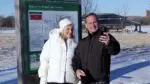 Cathy and Rob Janek, participants of the Be a Trailblazer experience snap a selfie infront of the welcome sign at Whalon Lake Preserve in Naperville.