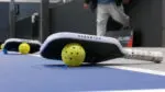 close up of a pickleball paddle and ball used for a world record in Naperville