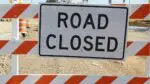 Road closed sign close up