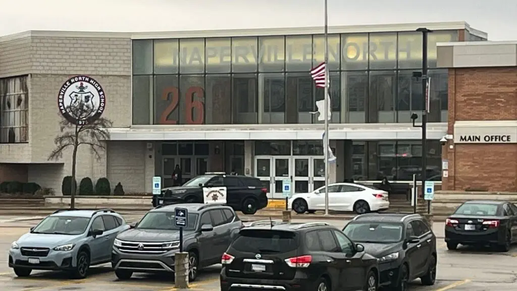 Exterior of Naperville North High School with police car in front of school after lockdown due to reported threat