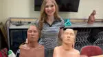 Naperville Central High School senior Ashlynn Goldstein poses with two female-bodied CPR mannequins that were donated to the school in her honor