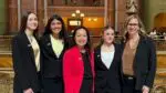 Naperville eighth-graders Liza Disanto, Sofia Nicoloudes and Ahana Patel and their teacher Barb Bell, take a picture with Illinois Representative Janet Yang Rohr, while at the state capitol advocating for an official Illinois state bee.