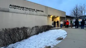 People lined up outside D203 administration building for meeting