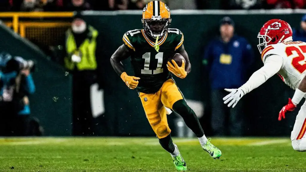 Jayden Reed gets ready to avoid a tackle.