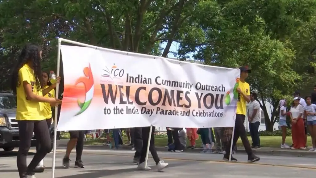 People holding banner for India Day Parade