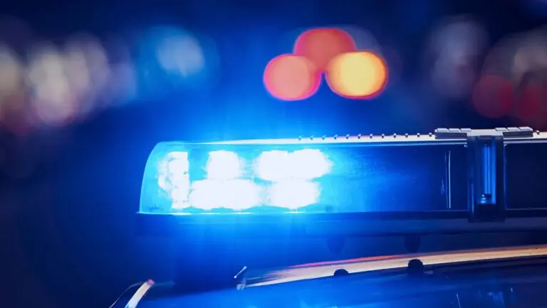 Blurred image of police lights at night for story on reported gunshots investigated