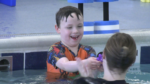 A kid taking swim lessons at Big Blue Swim School