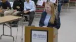 Jessica Hurt at IPSD 204 podium at board meeting