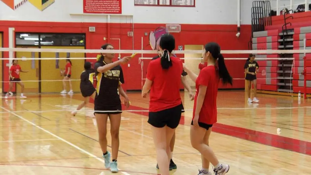 Redhawks Tian and Zheng and Metea's Gupta and Kotagiri come together after a great match.