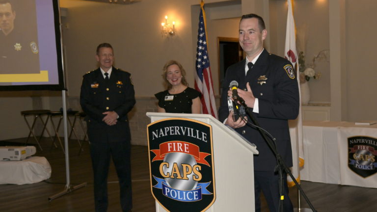 Officer Peter Pogwizd receiving the A. George Pradel award