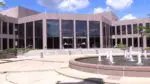 Exterior of Naperville City Hall building with fountain in foreground
