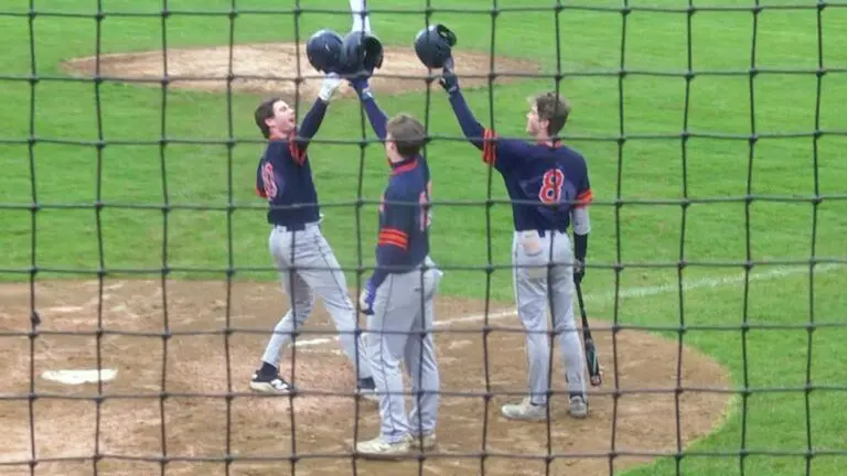 Sam Steele salutes his teamates after launching a two-run home run in win over Metea.
