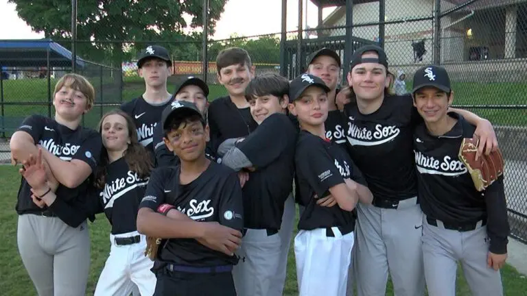 The Ravens pose for a team photo after an 11-9 victory.
