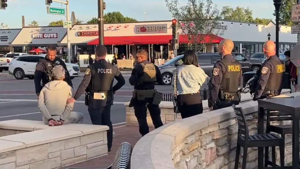 Naperville Police arrest a teen during the teen takeover in downtown Naperville.