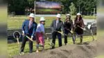Groundbreaking for Benet stadium project with officials holding shovels
