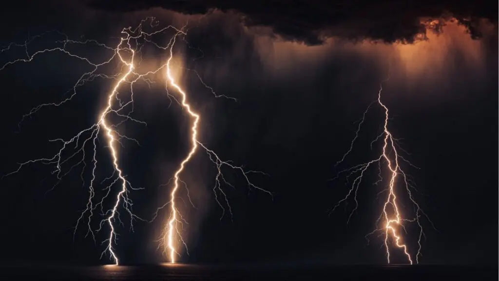 A photo of lighting striking during a thunderstorm.