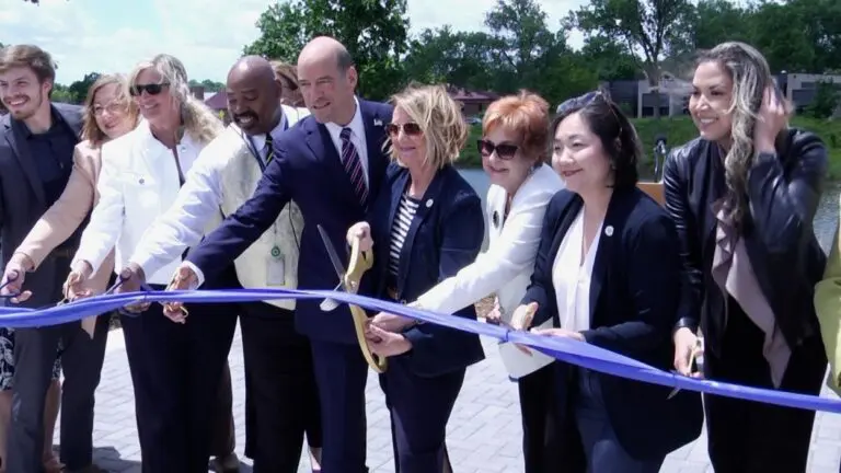 DuPage County officials cut a ribbon at the opening of the new Victims of Violence Memorial Park.
