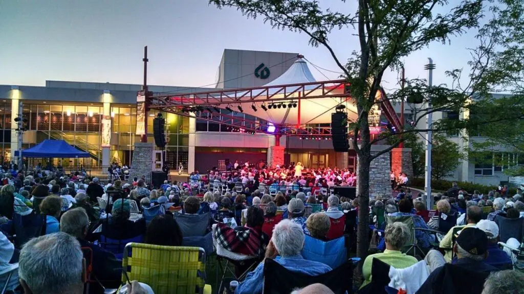 Wide shot of people attending outdoor concert at the MAC at Collelge of DuPage