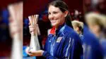 Kelly Murphy poses with the FIVB Trophy.