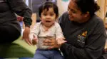 A child with a staff member of MFSD.